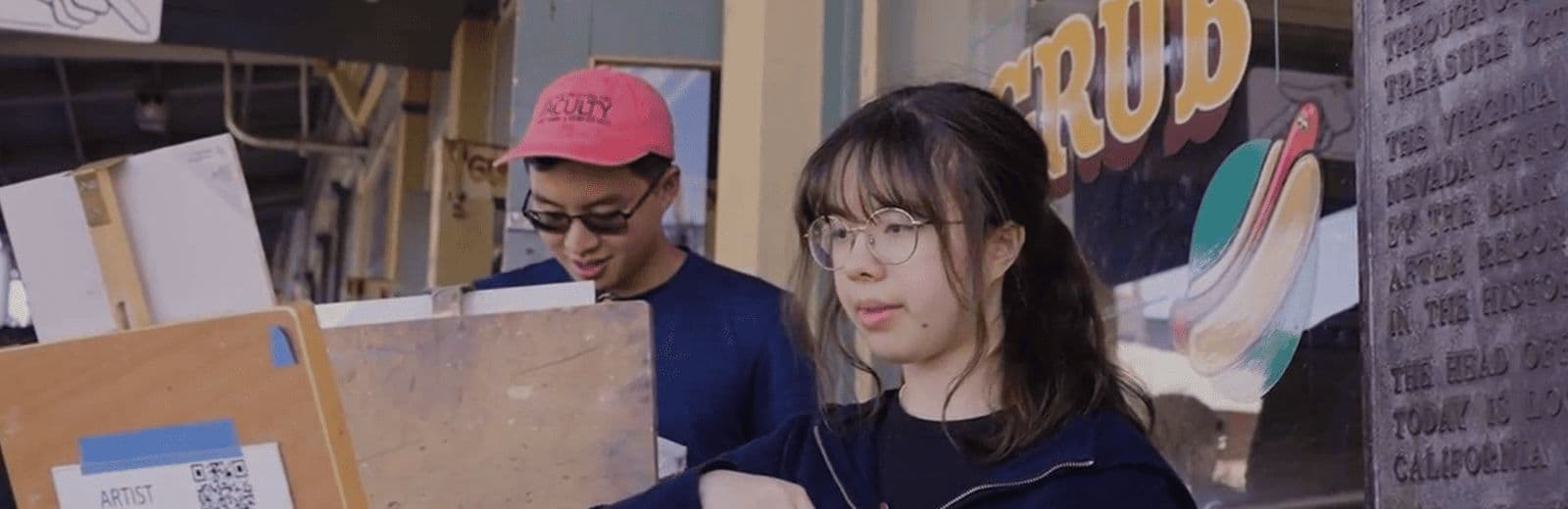 Two Streamline artists painting together outdoors